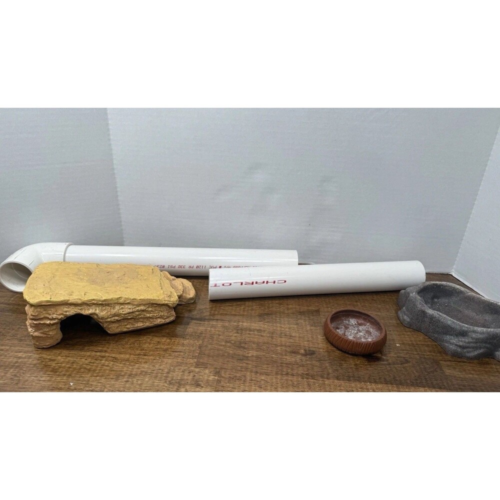 miscellaneous  Reptile supplies, One hide, PVC tubing, Food and water bowl ￼